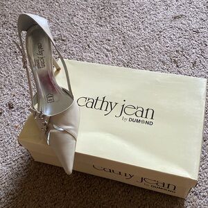Cathy Jean made in Brazil.size 7, upper leather in light cream,2 buckles on top.